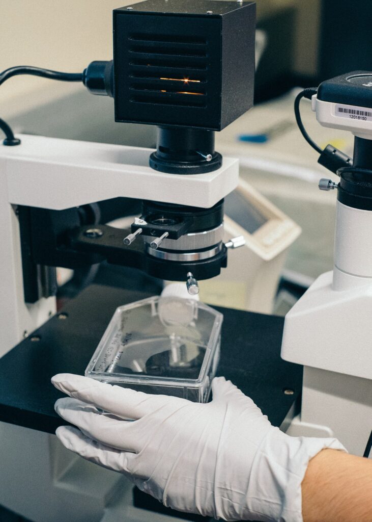 A man using a microscope.